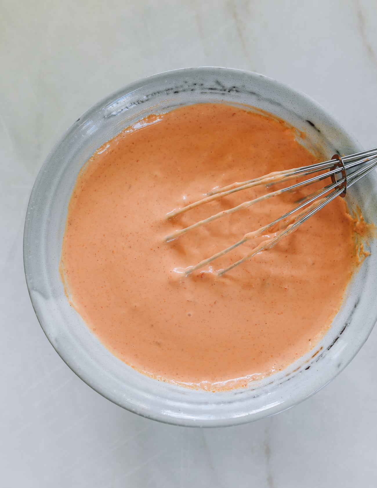 Bowl of yum yum sauce with whisk