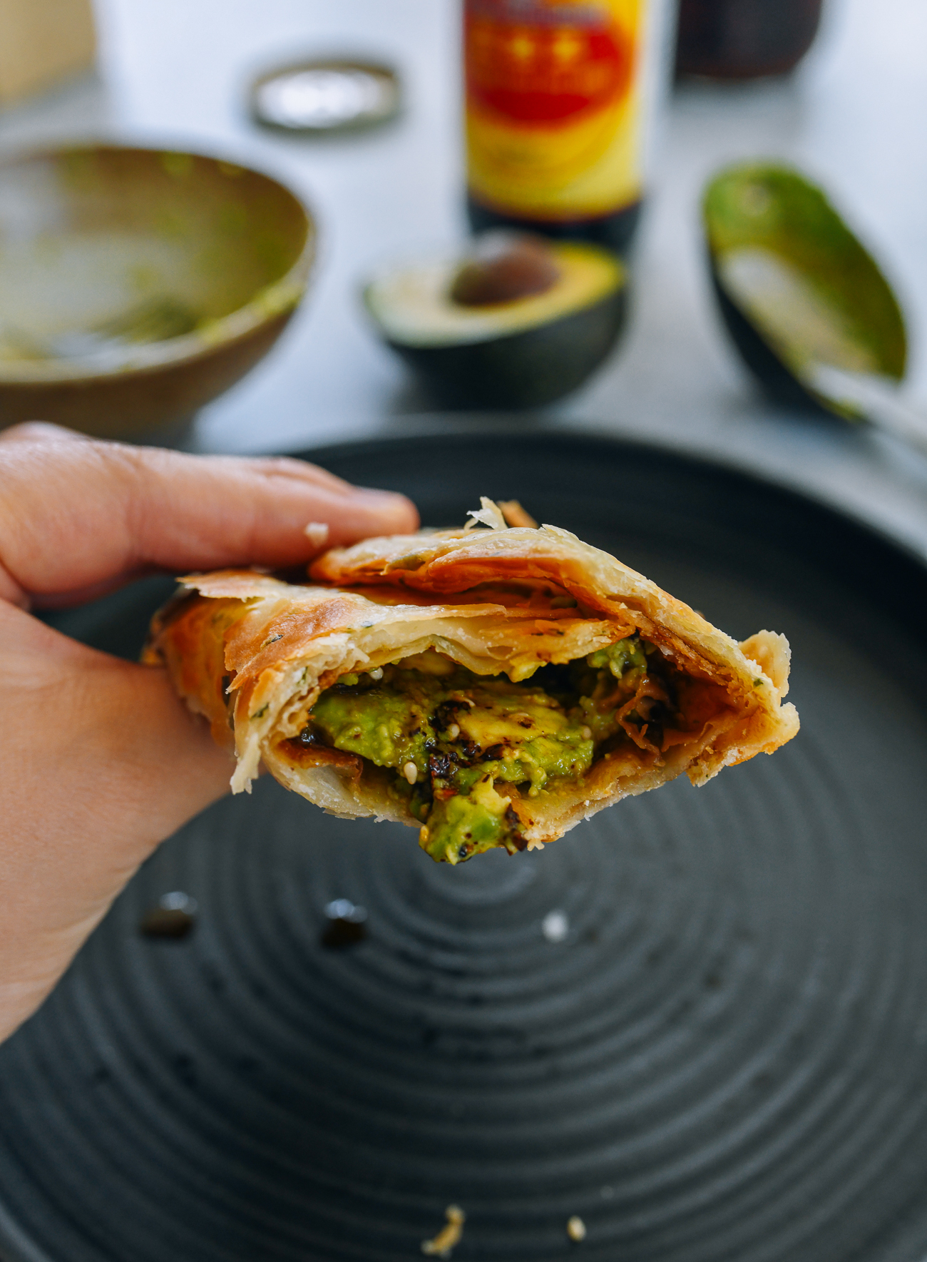 rolled up scallion pancake with avocado