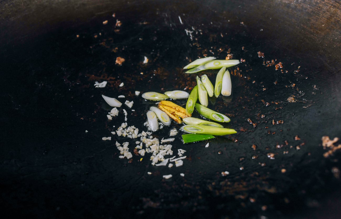 scallions, ginger, and garlic in wok