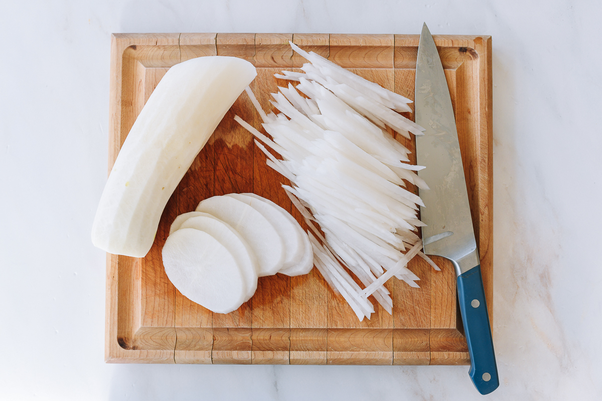 julienned daikon on cutting board