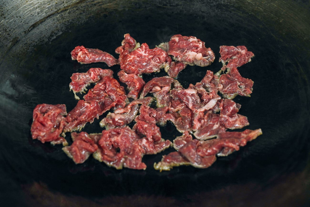 searing beef in wok