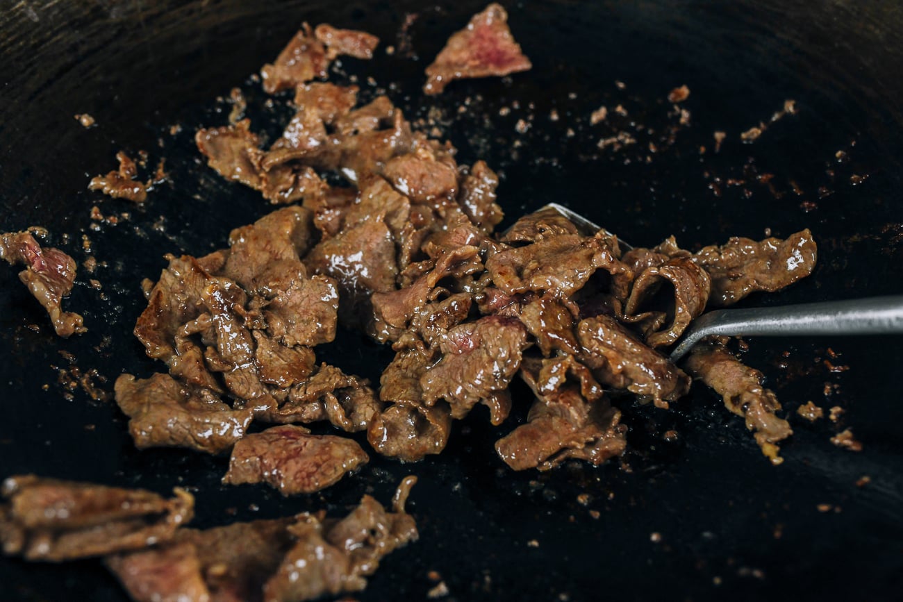seared beef in wok