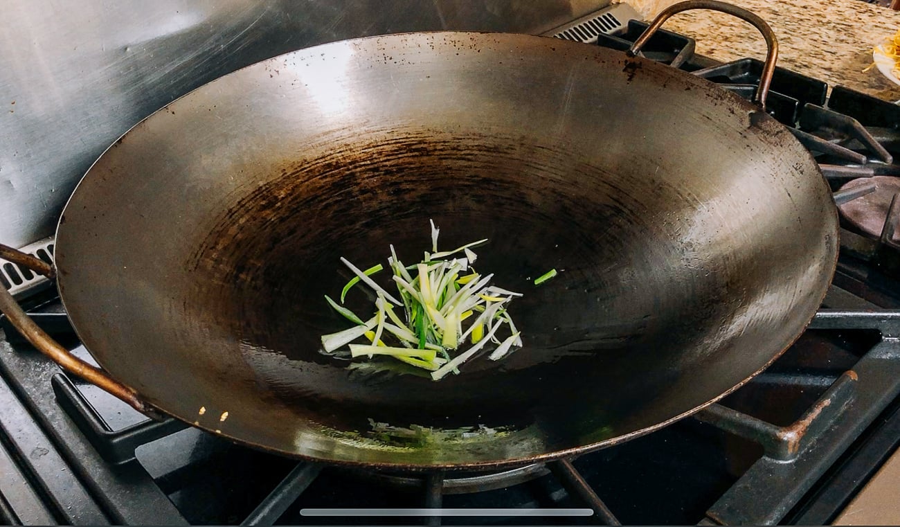 julienned scallions in wok