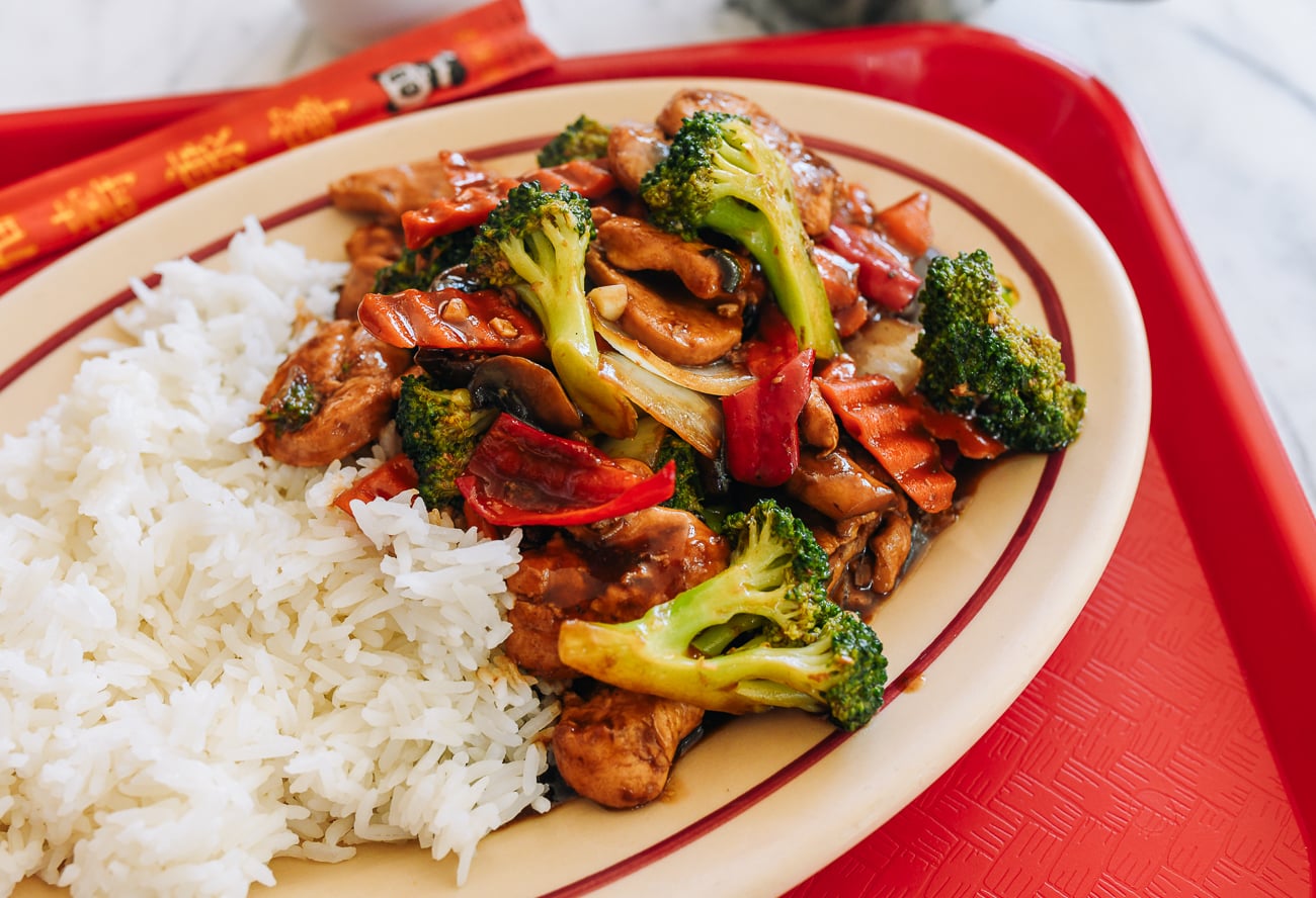 Plate of chicken with mixed vegetables and white rice