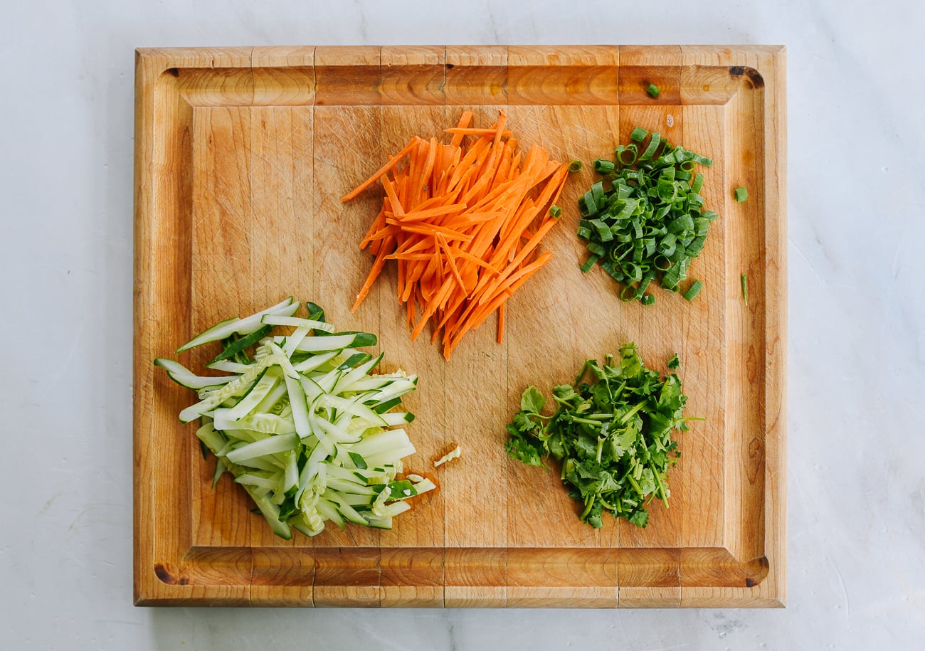 cold noodle toppings, julienned carrots, cucumbers and chopped cilantro and scallion