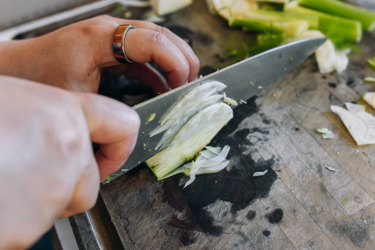 thinly shaving fennel with chef's knife