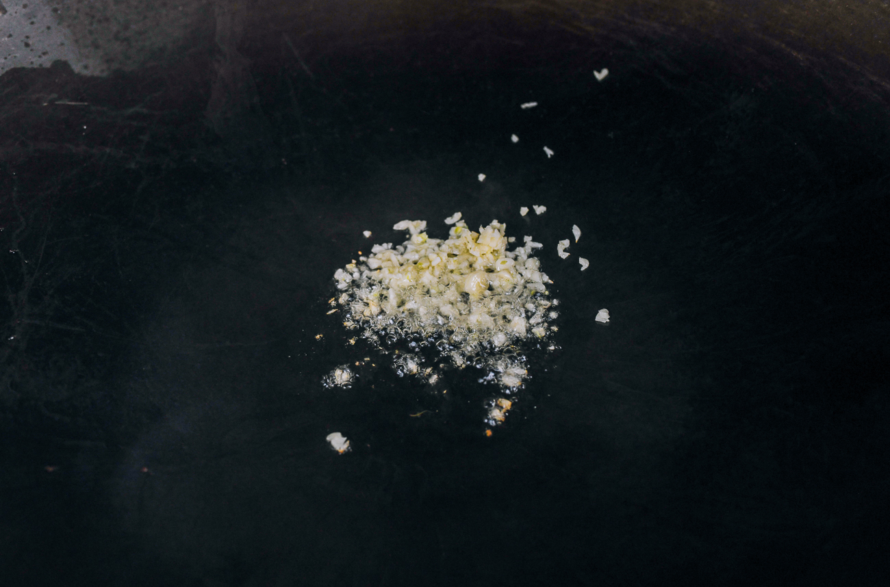 cooking chopped garlic in oil