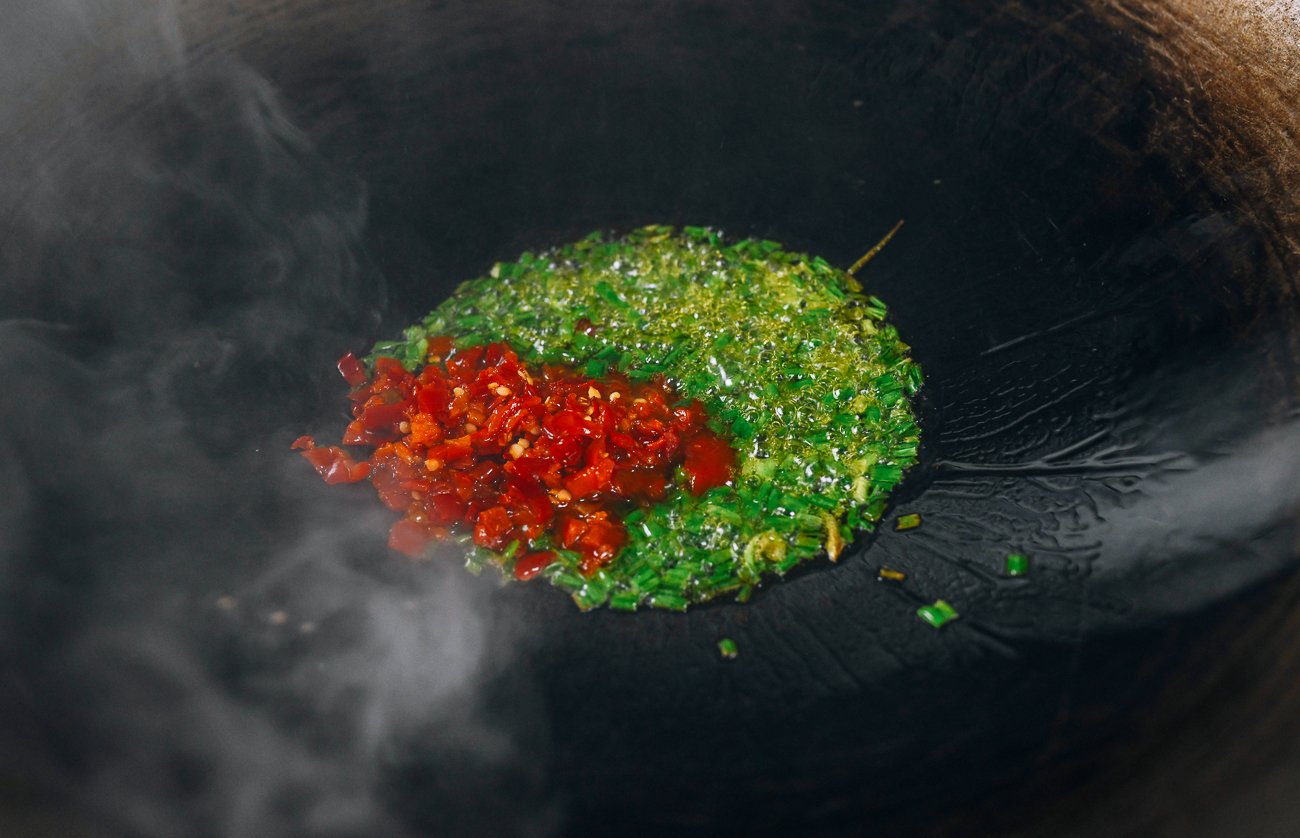 chives and duo jiao in wok