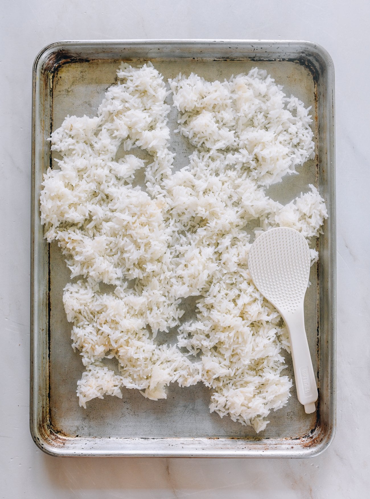 cooling fried rice on sheet pan