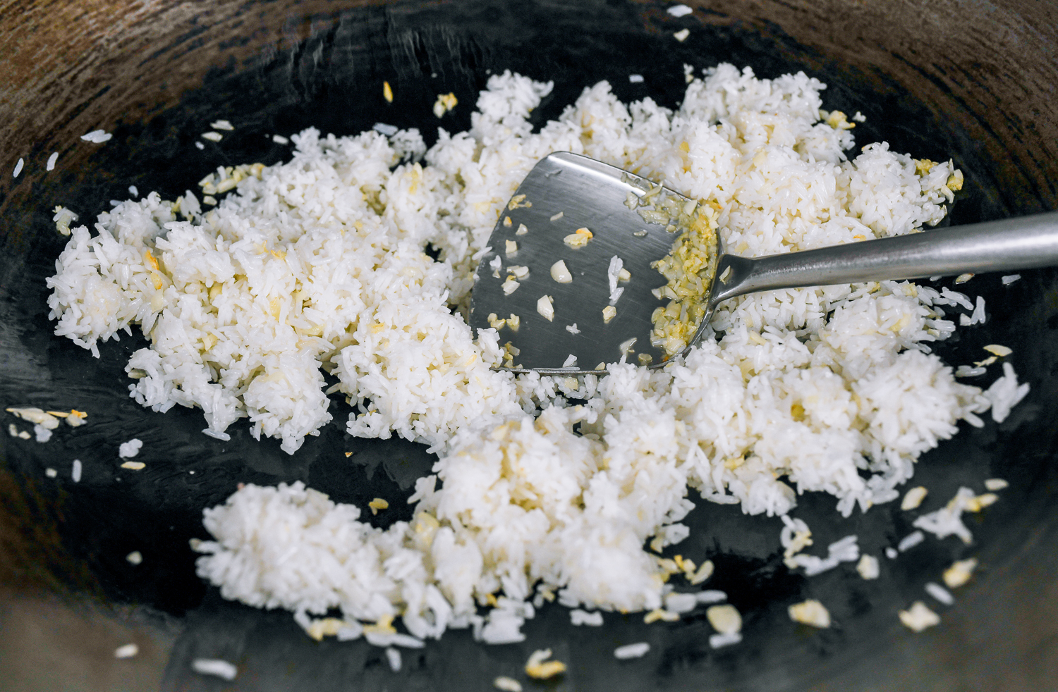 frying rice to coat it in oil and garlic