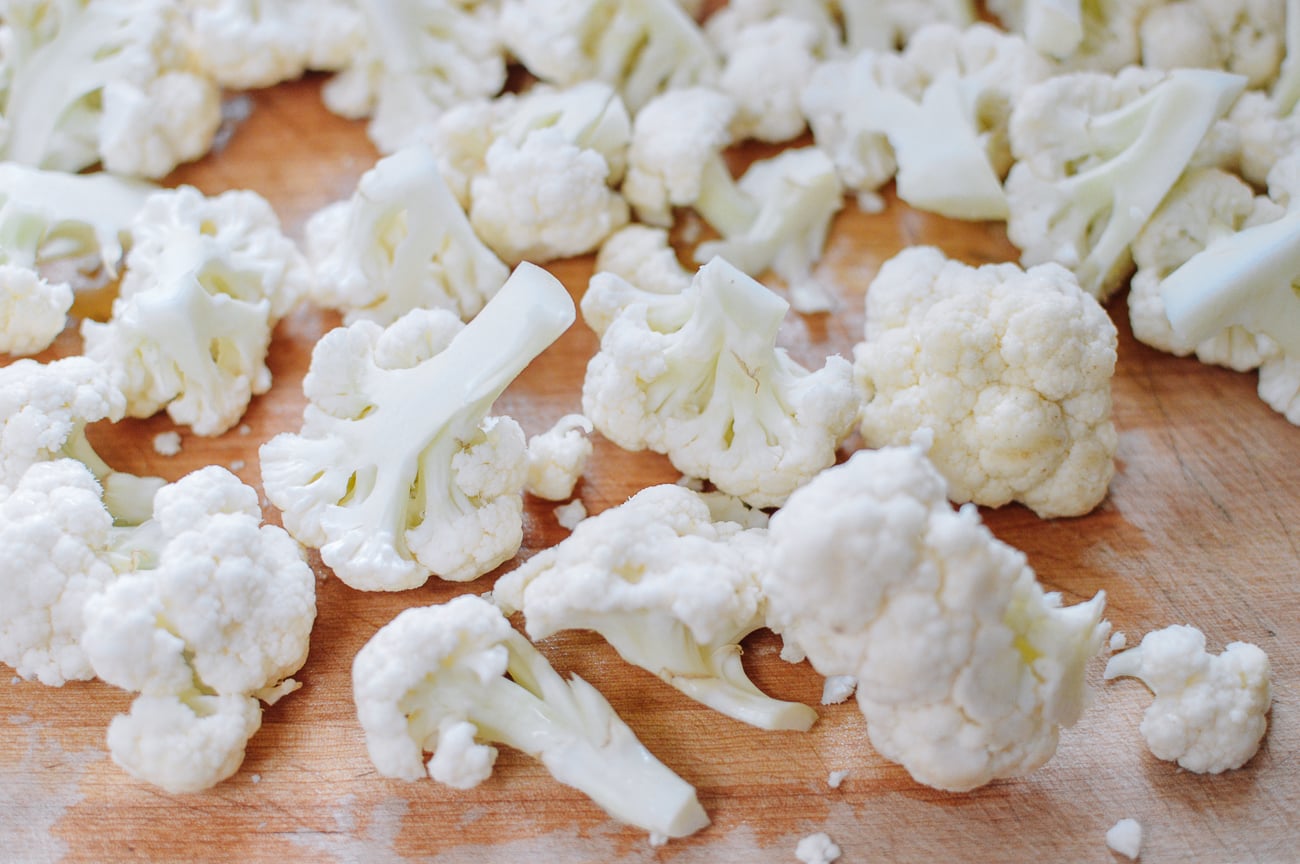 cauliflower florets on cutting board