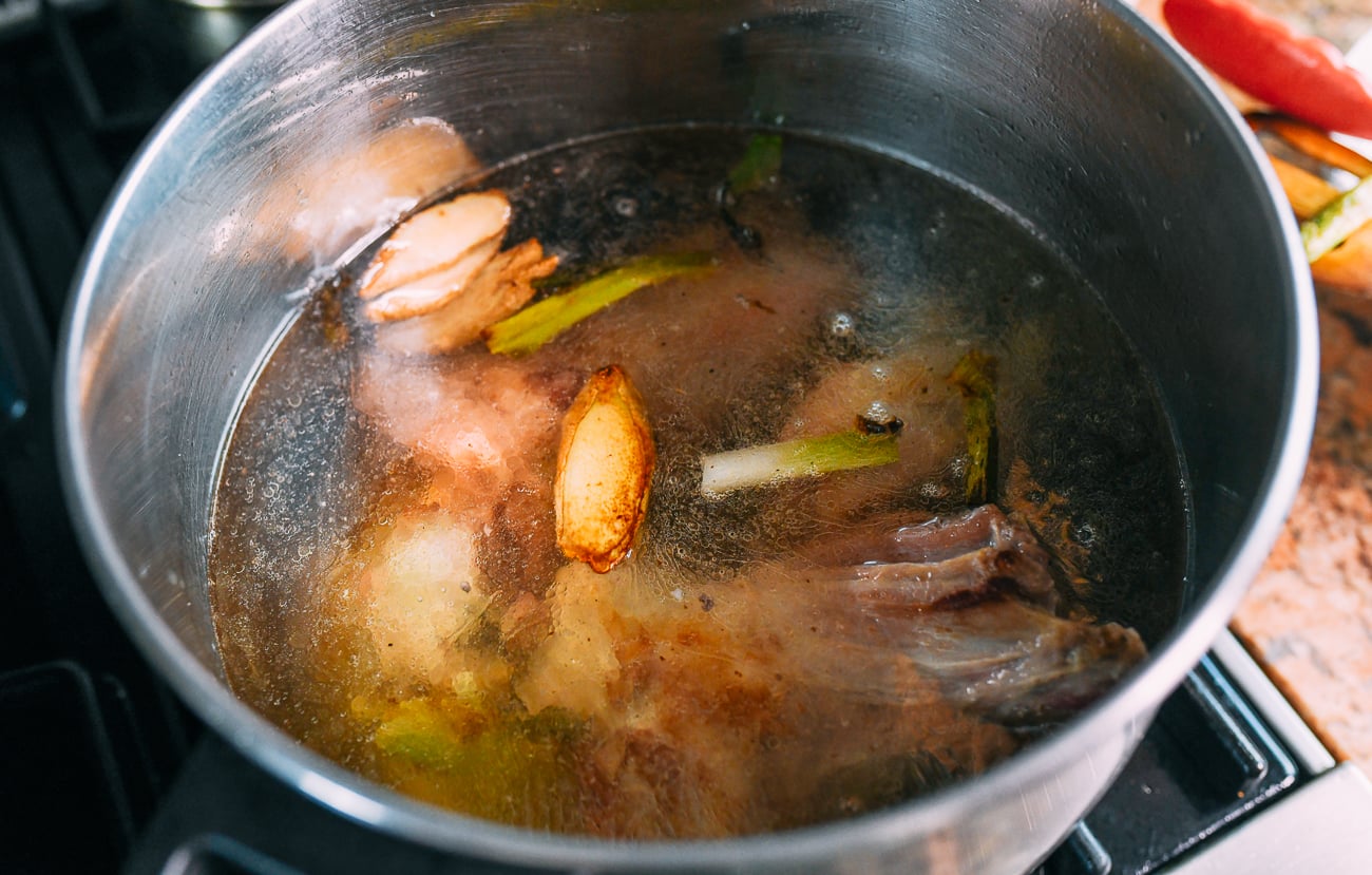 Pot of lamb shanks with 12 cups of water