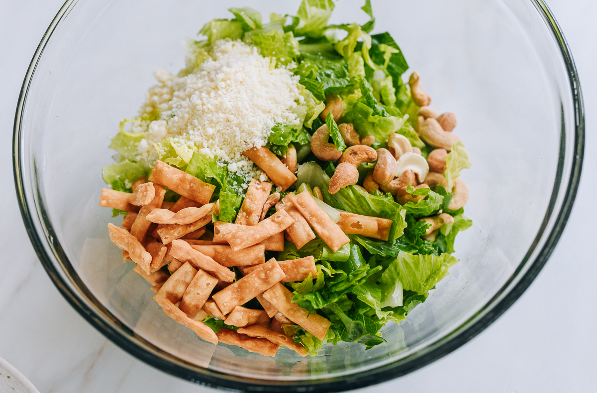 miso caesar salad ingredients in bowl