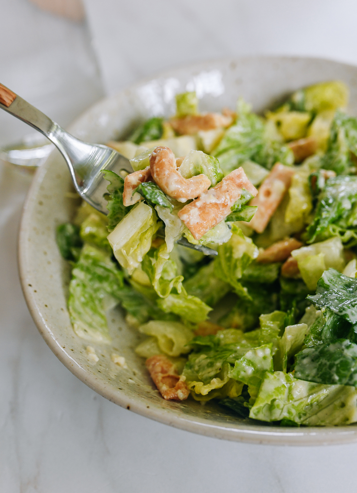miso caesar salad with cashews and wonton chips