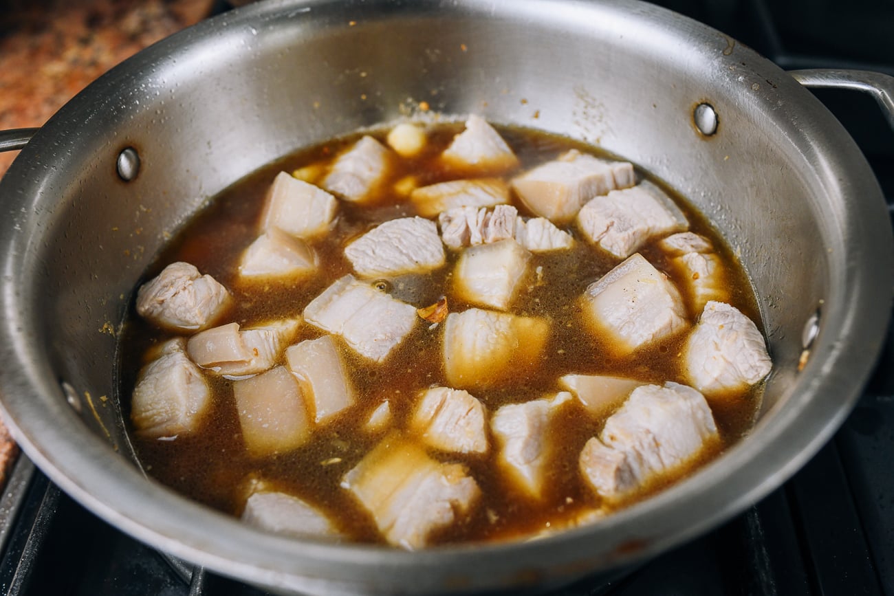 pork belly in pot with braising liquid