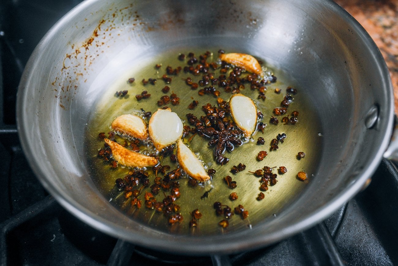 infusing oil with garlic cloves, sichuan peppercorns and star anise