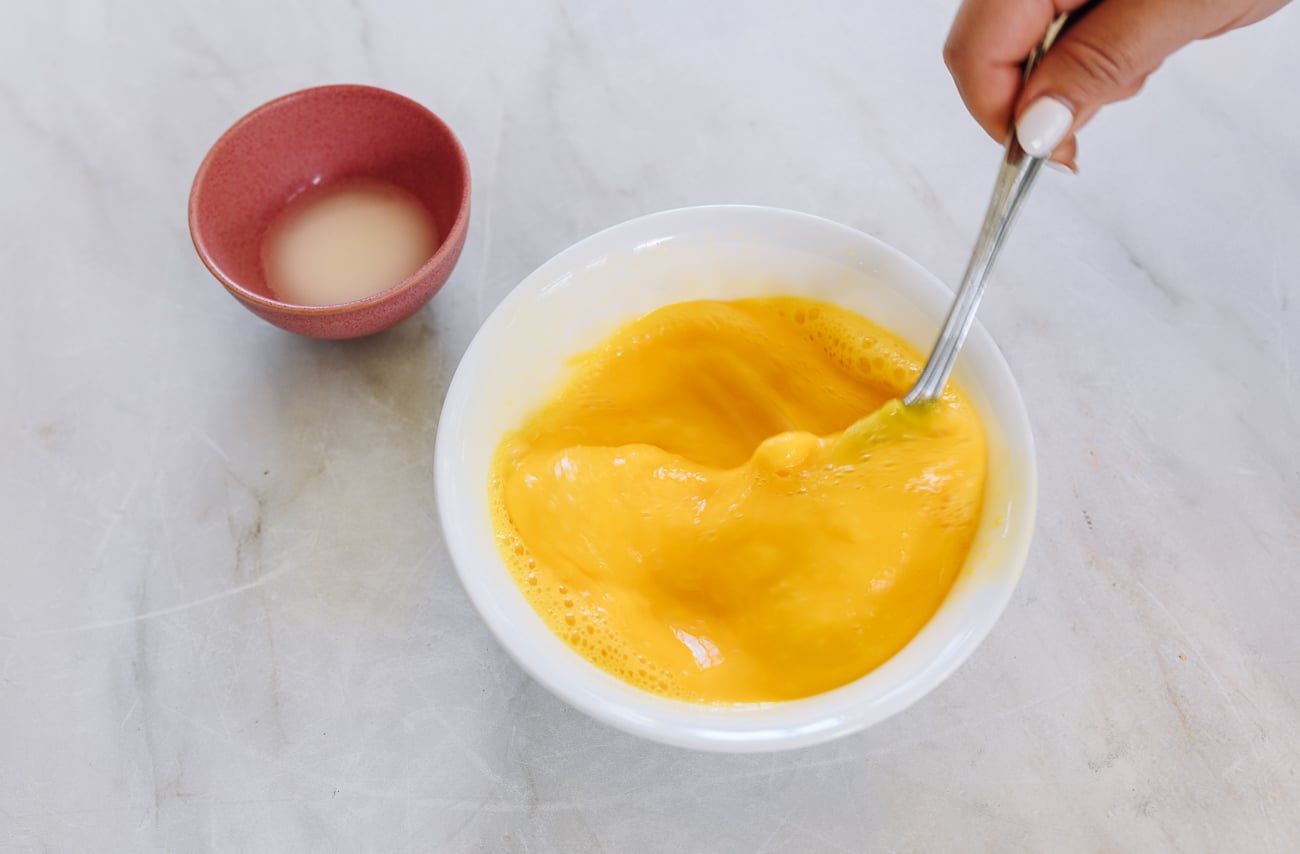 beating eggs in bowl