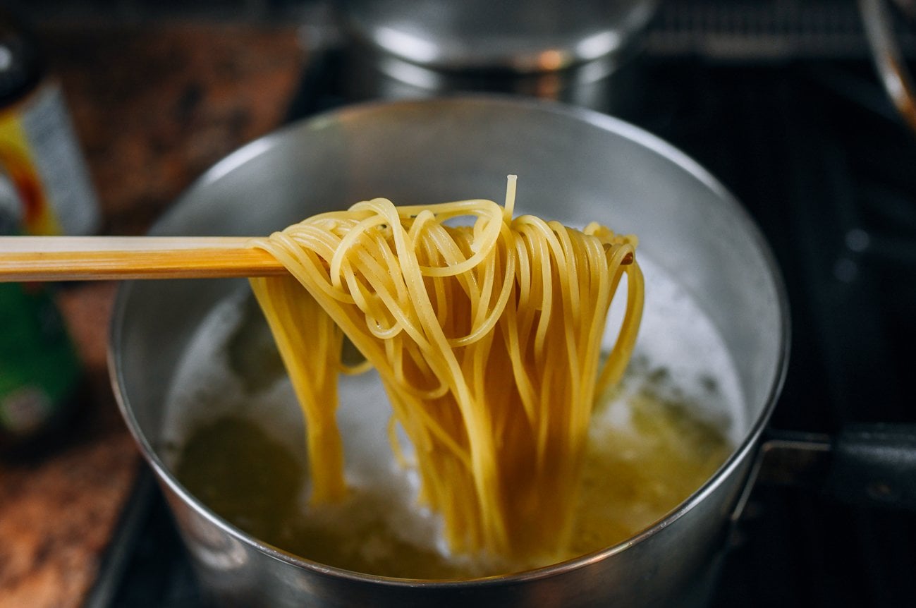 cooking spaghetti in boiling water