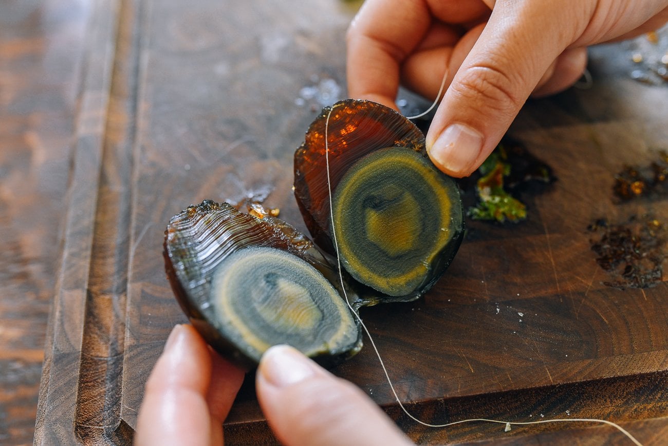 slicing century egg with thread