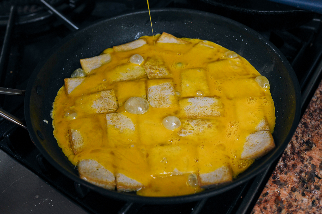 Beaten egg over the top of pan-fried tofu