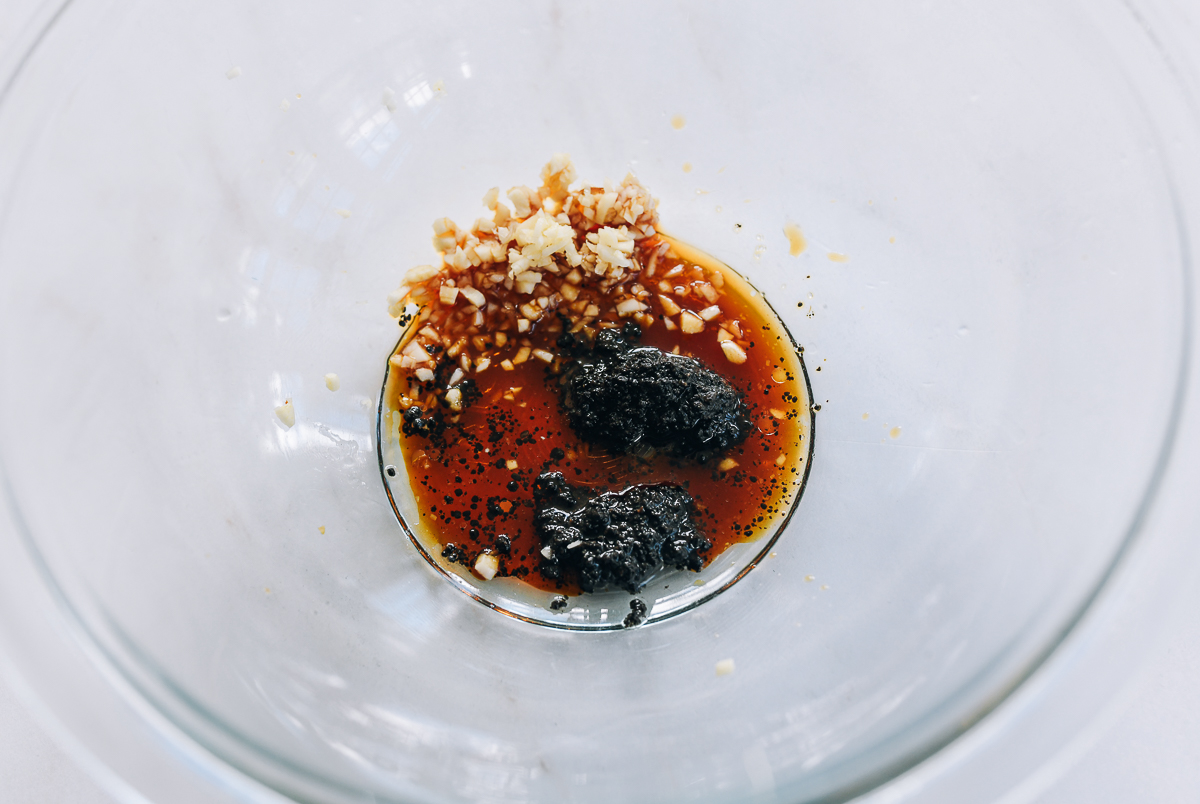mixing truffle pâté with garlic, soy sauce, and sugar