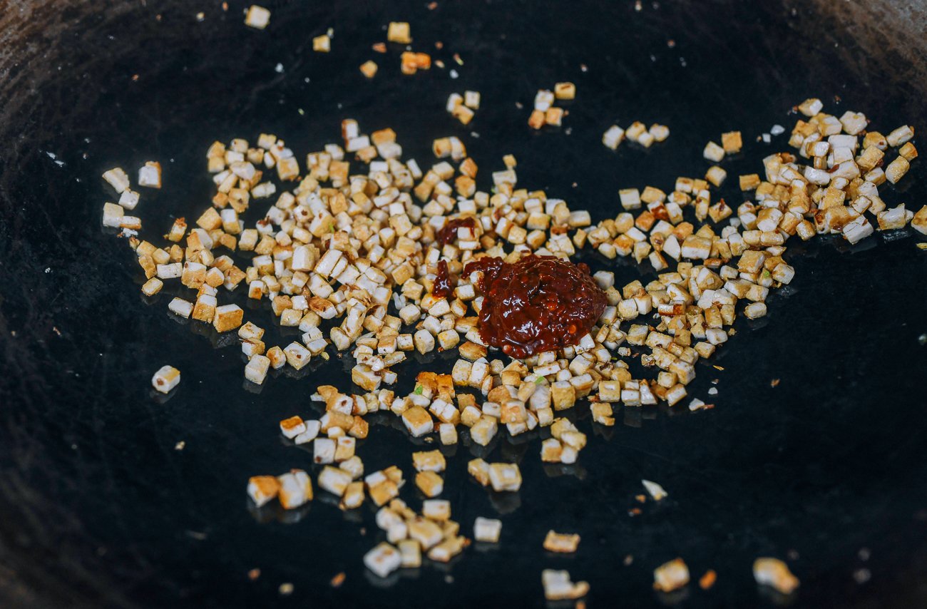 Chinese spicy bean sauce added to tofu